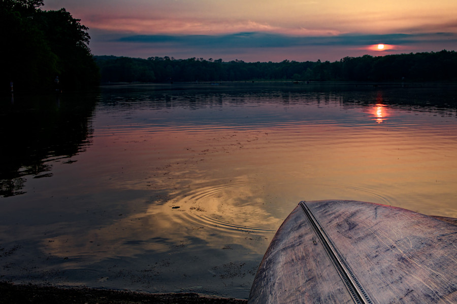 Kayak on the lake at sunset